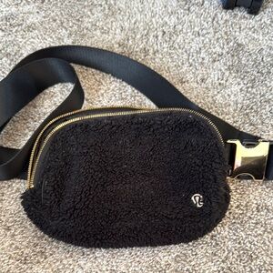 Lululemon pre loved Black Fleece Belt Bag with Gold Accents